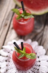 Water melon smoothie on wooden table