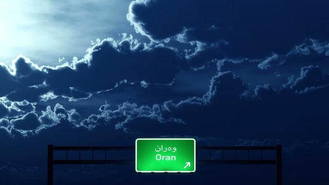 Passing under Oran Algeria Highway Road Sign at Night
  