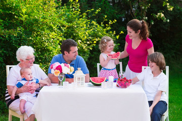Big family having lunch outdoors