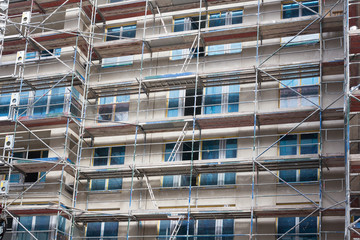 new building construction site with scaffolding