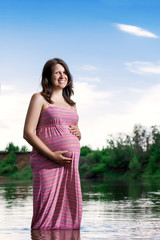 Pregnant girl on the nature