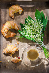 Sweet hot coffee and fresh croissant