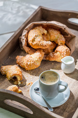 Spring breakfast with hot coffee and fresh croissant