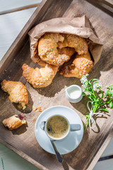 Sweet breakfast with croissant and coffee