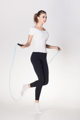 beautiful woman jumping rope