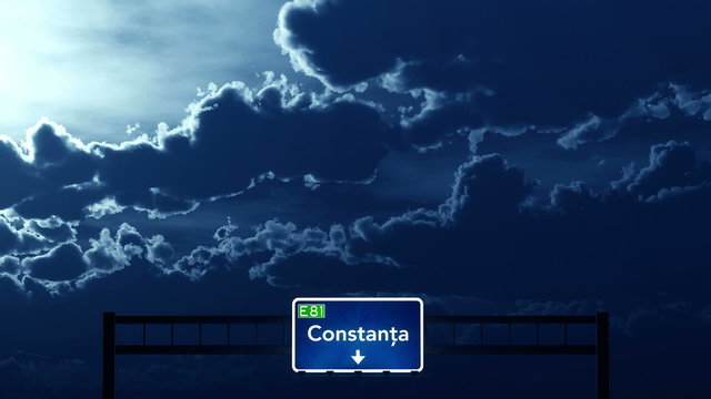 Passing under Constanta Romania Highway Road Sign at Night
  