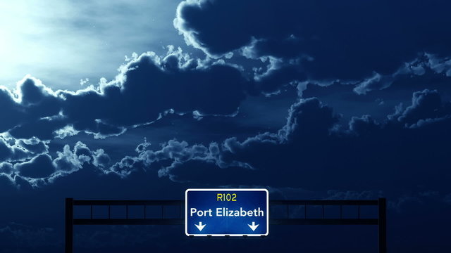 Passing under Port Elizabeth South Africa Highway Road Sign at Night
  