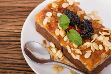 Closeup homemade toffee cake with mulberry