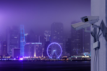 Fototapeta na wymiar Surveillance Security Camera or CCTV over Hong Kong night city