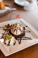 Ice cream brownie on the wooden table.