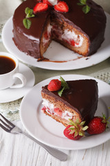Cut cake with strawberry and chocolate close-up. Vertical
