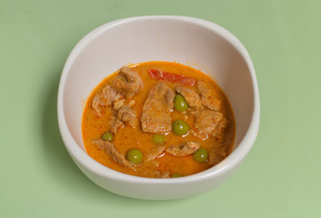 Red curry with pork on the white dish