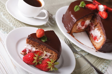 strawberry cake with chocolate and coffee on the table