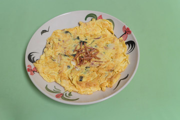 seaweed and squid omelette on the white dish