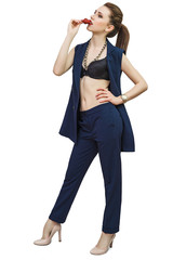 Fototapeta premium Sensual elegant woman in office outfit posing in a studio