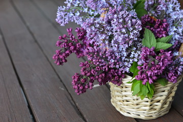 basket with  branch of lilac