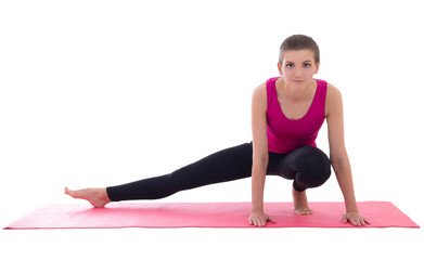 pretty slim woman doing stretching exercise on yoga mat isolated