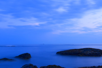 Sunset on a rocky shore.