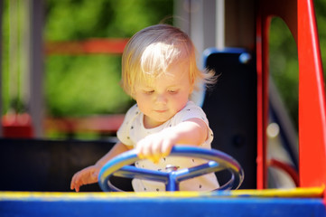 Fototapeta na wymiar Toddler boy on playground