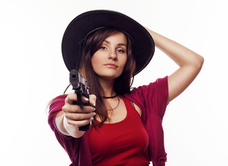 Young cowgirl holding gun