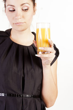 Portrait of beautiful woman with a glass of juice