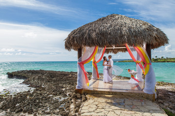 Young loving couple wedding in gazebo