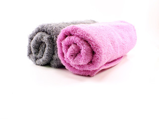 Obraz na płótnie Canvas pink and gray towel towel on the background