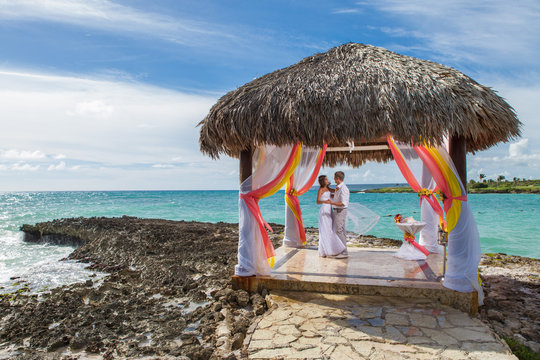 Young Loving Couple Wedding In Gazebo