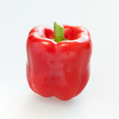 Red capsicum or sweet pepper on white background