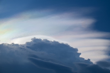 Cloud iridescence phenomenon. Iridescent pileus cloud