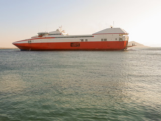 Catamaran leaving port. Vacation time.