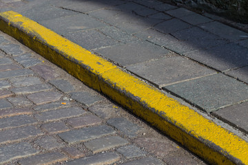 Yellow curb stone border