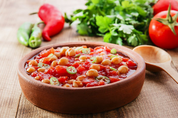 cooked chickpeas with tomatoes in a bowl