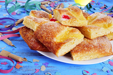 streamers, firecrackers and coca de Sant Joan, typical sweet cak