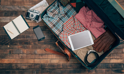 Hipster traveler packing