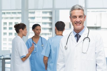 Fototapeta premium Portrait of a smiling confident male doctor