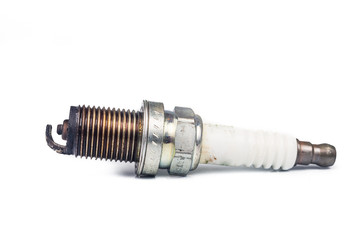 Close up of used spark plugs with focus on electrode with deposits