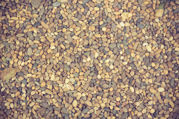 background with dry round stones vintage color