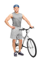 Fototapeta premium Young biker posing with his bicycle