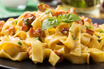 Pasta Carbonara with bacon, basil and cheese