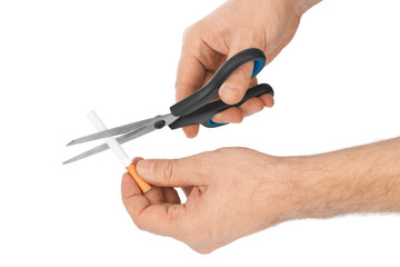 Hand with scissors and cigarette