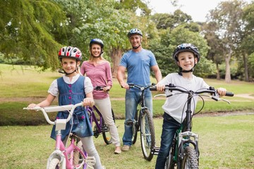 Happy family on their bike at the park 