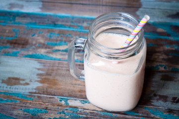 Smoothie milkshake made from peach,melon and papaya blended with kefir yogurt. Served in a jug...