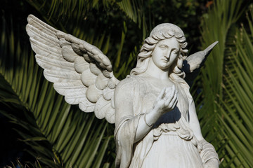 marble female winged statue closeup