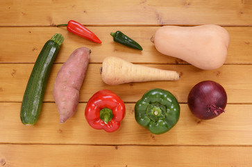 Selection of raw vegetables on a wooden table