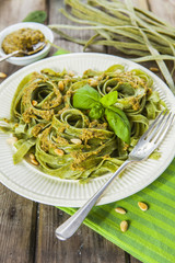 Homemade spinach pasta with pesto