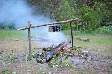 Preparing food on campfire 