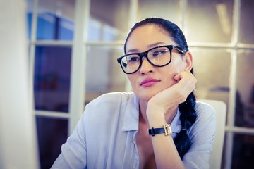Bored woman sitting at her desk