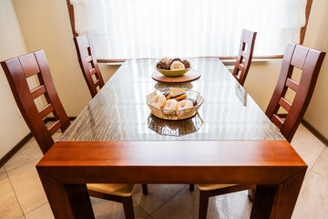 Fresh donuts lying in the basket on the table