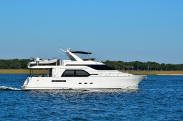 Fototapeta na wymiar luxury yacht cruising along the river at Florida, USA